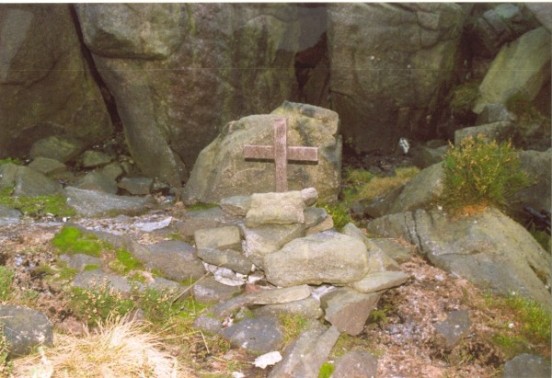 Memorial cross and wreckage at the crash site of de Havilland Canada L-20A Beaver 52-6145