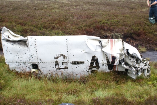 Wing at the crash site of Piper Cherokee G-AVYN at Ashfold Gill Head near Pateley Bridge, North Yorkshire